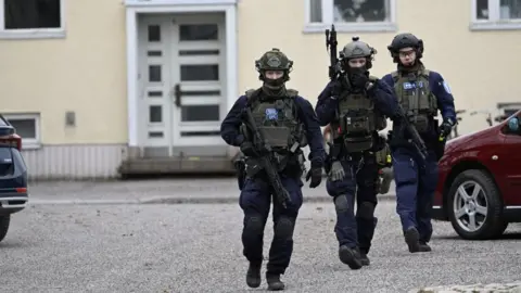 Lehtikuva/MARKKU ULANDER via REUTERS Police officers operate at the Viertola comprehensive school in Vantaa, Finland, on April 2, 2024