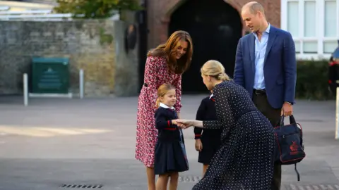 PA Media Princess Charlotte shakes hands with the head of the lower school