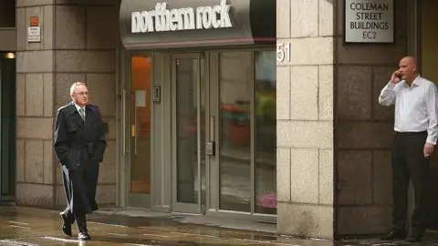 Getty Images Man outside Northern Rock