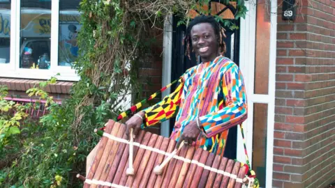 Glenn Edwards N'Famady Kouyate with his balafonist in Cardiff