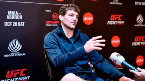 Photo by Jeff Bottari/Zuffa LLC via Getty Images Ben Askren speaks to the media in Singapore on Thursday