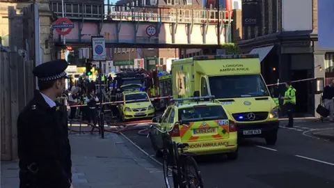 Shahzad Afza Emergency services outside Parsons Green station