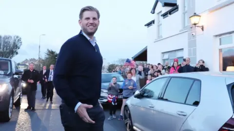 PA Eric Trump, the son of US President Donald Trump, pours drinks and meets locals in the village of Doonbeg in County Clare