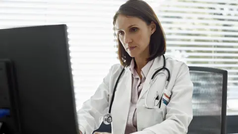 Getty Images Doctor at computer (file image)