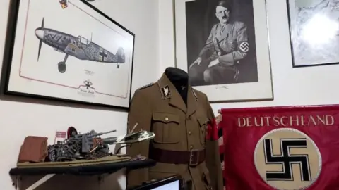 Rio de Janeiro civil police via Reuters Nazi objects are seen in a home of an alleged paedophile in Rio de Janeiro