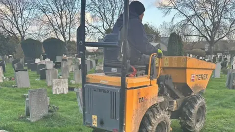 Alastair Chambers Digger next to graves