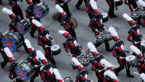 Reuters A marching band takes part in the parade