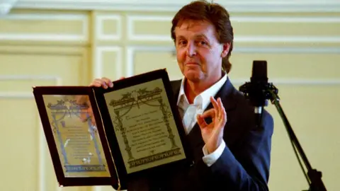 Getty Images Sir Paul McCartney with Russian award, 2 Jan 03