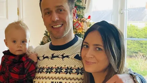 Paul Spence Paul Spence pictured with his partner and their daughter