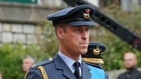 PA Media The Prince of Wales looks solemn as he wears military uniform