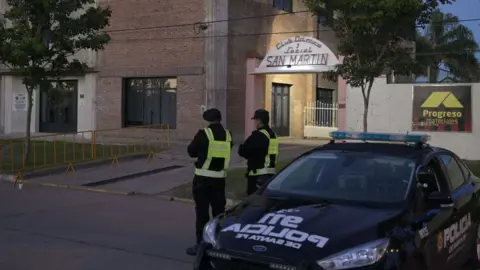 JUAN MABROMATA/AFP Police outside the wake