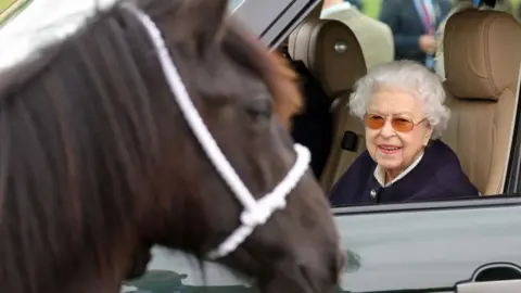 Getty Images The Queen looks on a horse at the Royal Windsor Horse Show