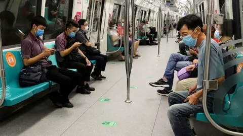 Getty Images People on Singapore underground