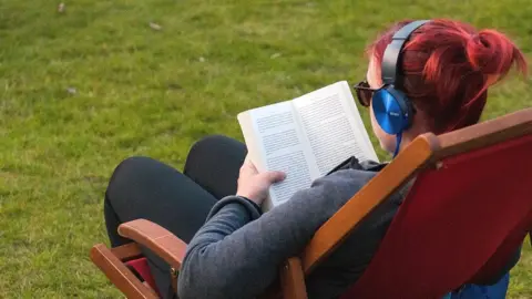 Getty Images Reading a book