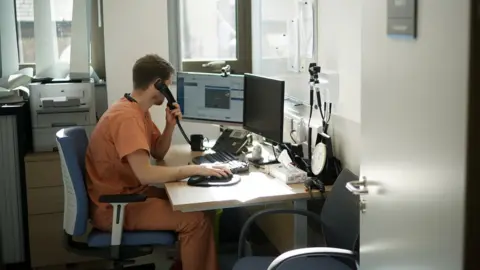 Getty Images GP using a home video link to asses a patient