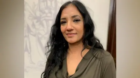 Dr Opinderjit Takhar smiling