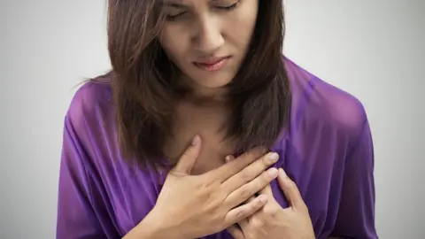 Getty Images Chest pain in a woman