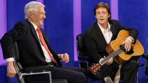 Ken McKay/Shutterstock Sir Michael Parkinson and Sir Paul McCartney in 2005