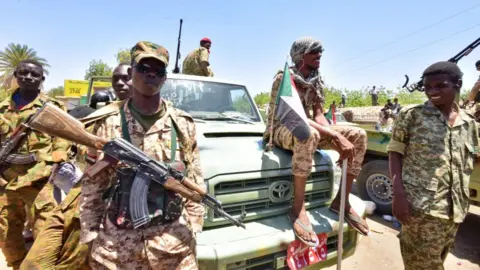 AFP Sudanese armed forces gather near the site of a demonstration close to military headquarters in the capital Khartoum on April 15, 2019