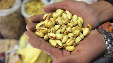 AFP Close-up of a handful of pistachio nuts taken in Tehran in 2006.