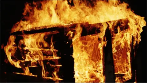 Getty Images Shed in flames