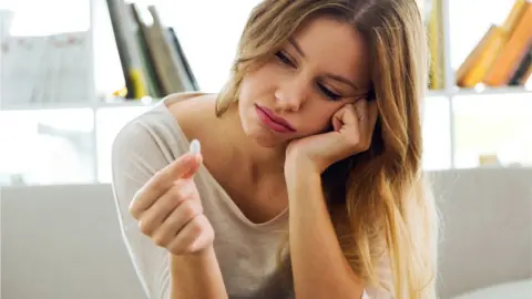 Getty Images woman with pill