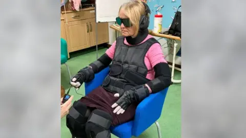 Brunel Care A woman in a dementia suit