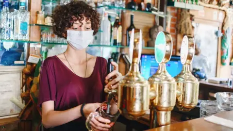 Getty Images Female hospitality worker - stock image