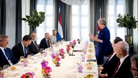 AFP Theresa May speaking at a lunch hosted by her Dutch counterpart Mark Rutte