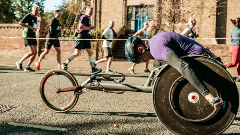 LimeLight Sports Club man in a wheelchair racing