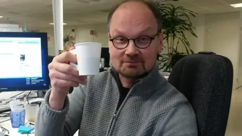 Niilo Simojoki Niilo Simojoki drinking a coffee in his office in Helsinki, Finland