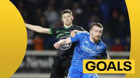 Coleraine's Rodney Brown challenges for the ball