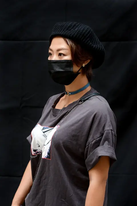 Lauren Crothers A protester poses for a portrait during the Anti-Totalitarianism march in Causeway Bay, Hong Kong, 29 September 2019