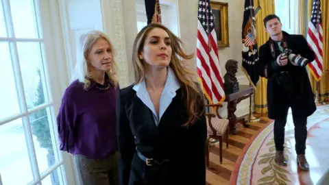 Reuters White House communications director Hope Hicks (C) in the Oval Office on 9 February 2018