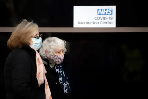 Getty Images People queueing for vaccination in Stevenage