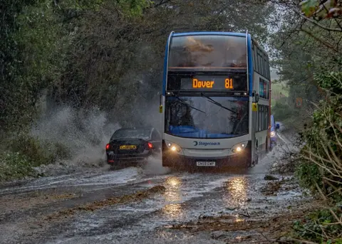 Stuart Brock/EPA-EFE/REX/Shutterstock A bus makes its way through heavy rain in Dover, Kent, Britain, 02 November 2023.