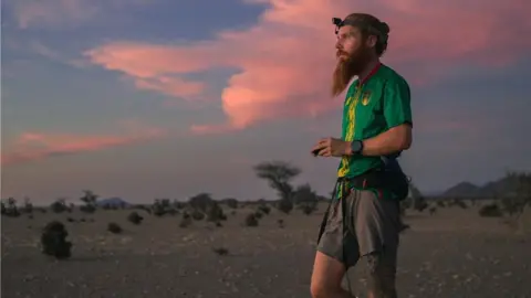 Guus van Veen Russell Cook running in Africa