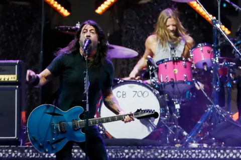 Getty Images Dave Grohl and Taylor Hawkins of Foo Fighters perform during day one of Lollapalooza Chile 2022 at Parque Bicentenario Cerrillos on March 18, 2022 in Santiago, Chile.