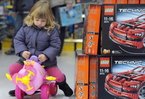 Getty Images File pic of girl playing with toy in a store in France