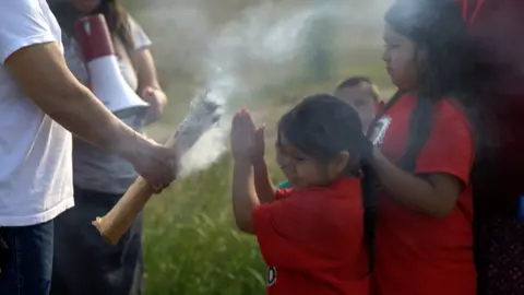 BBC A young girl participates in a walk for missing and murdered indigenous women