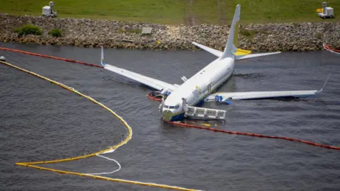 AFP Miami Air International Boeing 737 in St John's River