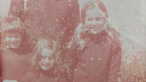 Bobbie Hillman Three children wearing Guernseys