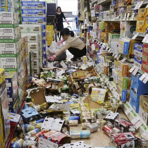 Reuters Supermarket with food fallen off the shelves