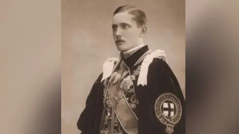 Public domain Man with short hair and moustache wearing royal robes in black and white photo