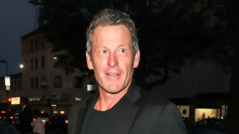 Lance Armstrong looks on while attending an event in Los Angeles in 2018