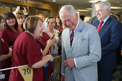 Getty Images Prince Charles, Prince of Wales meets hospital staff as he visits Ysbyty Aneurin Bevan