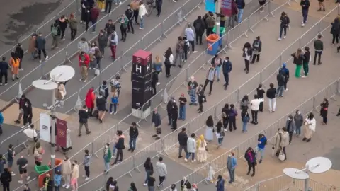 PA Media A queue at London Stadium