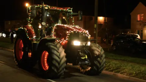 Andrew Mutimer A tractor decorated with Christmas lights