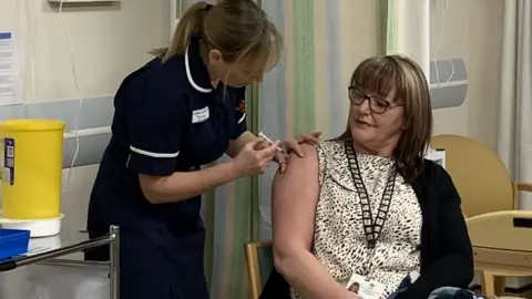 BBC Sandie Hannay being given the vaccine