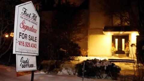 Reuters A For Sale sign outside the Toronto home of Barry Sherman and his wife Honey. 15 Dec 2017